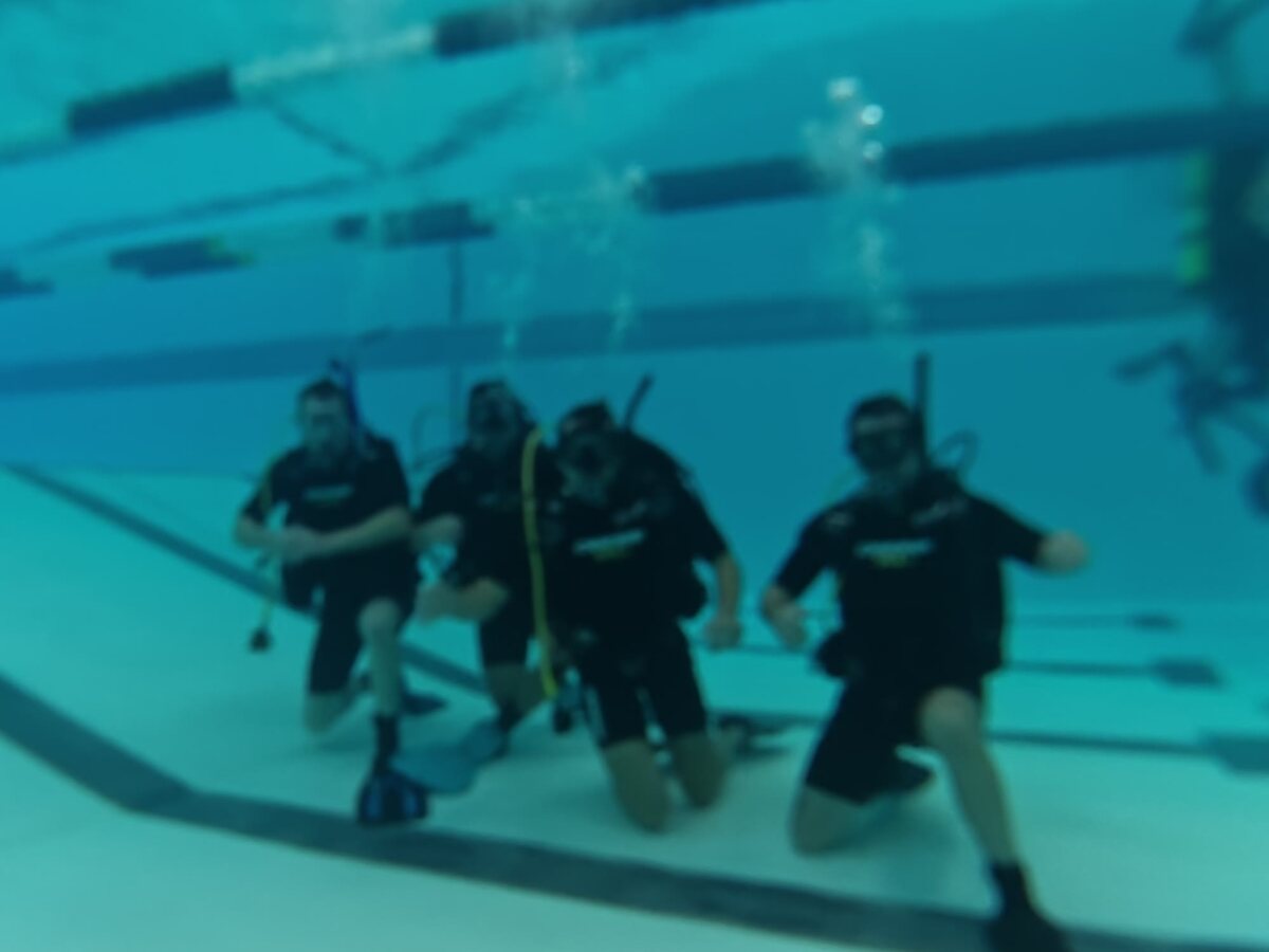 Students practicing skills in the pool